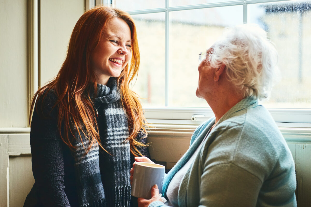 Pretty young woman talking with her mother